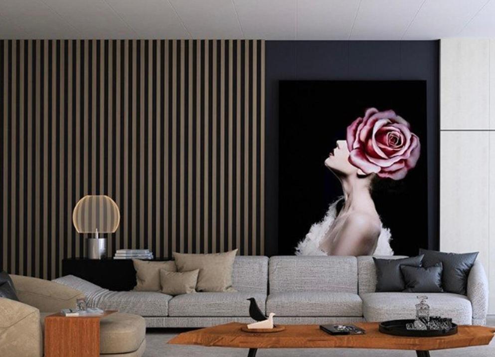 a living room with a couch with a flower on the wall at M Boutique Apartments in Thessaloniki