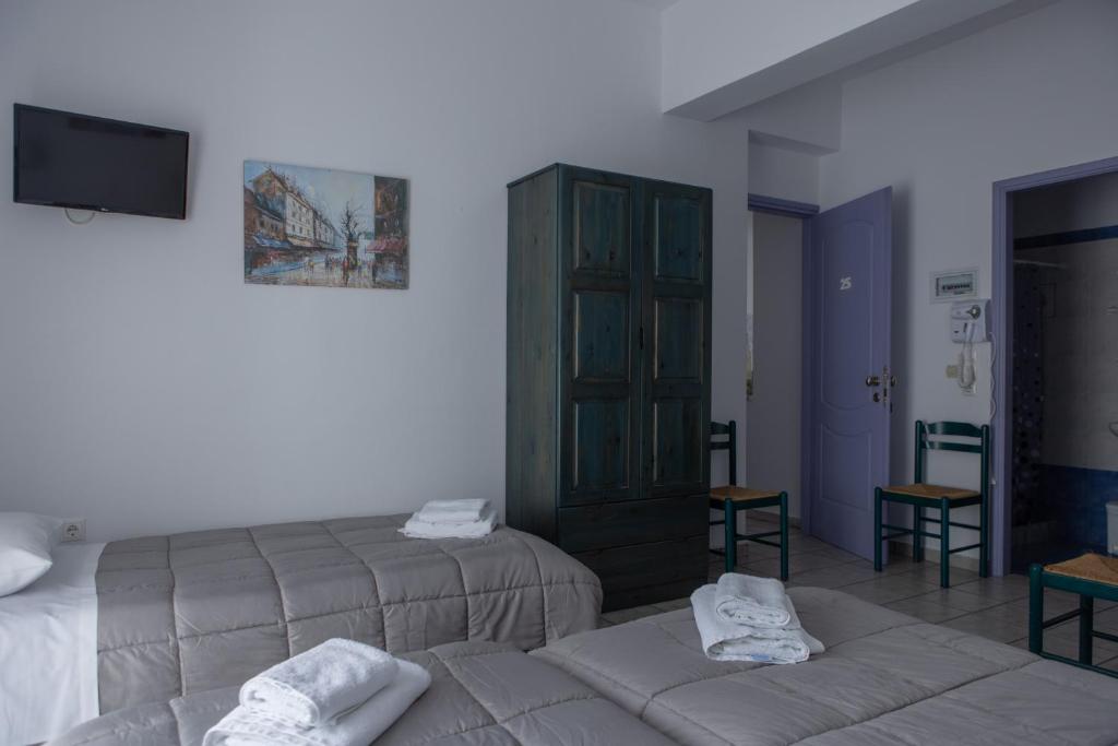 Postel nebo postele na pokoji v ubytování Soula Rooms Tinos