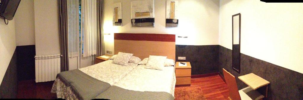 Posteľ alebo postele v izbe v ubytovaní Hostal San Sebastian Centro