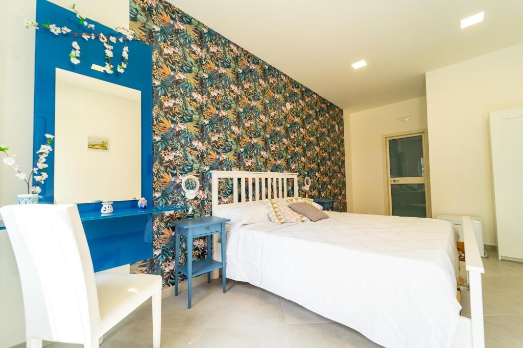 Letto o letti in una camera di Nientemale Residence Napoli