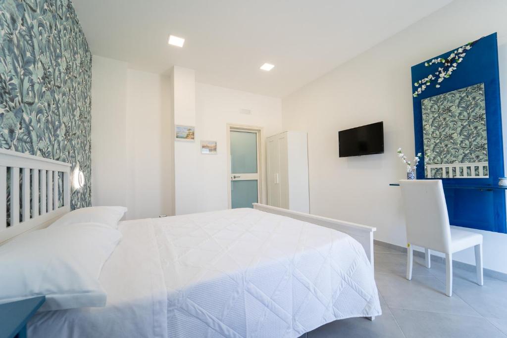 Letto o letti in una camera di Nientemale Residence Napoli