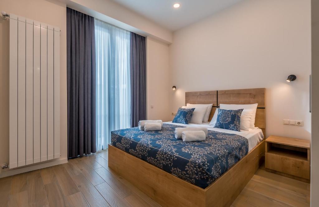 Postel nebo postele na pokoji v ubytování New Gudauri Apartments