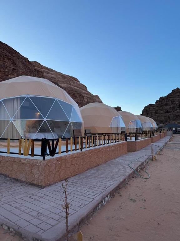 a row of domes on a building in the desert at Wadi Rum stael Luxury Camp in Wadi Rum