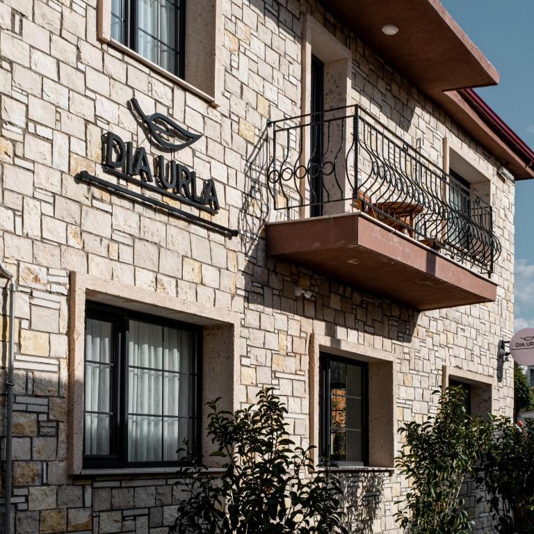 a building with a sign on the side of it at Dia Urla in Urla