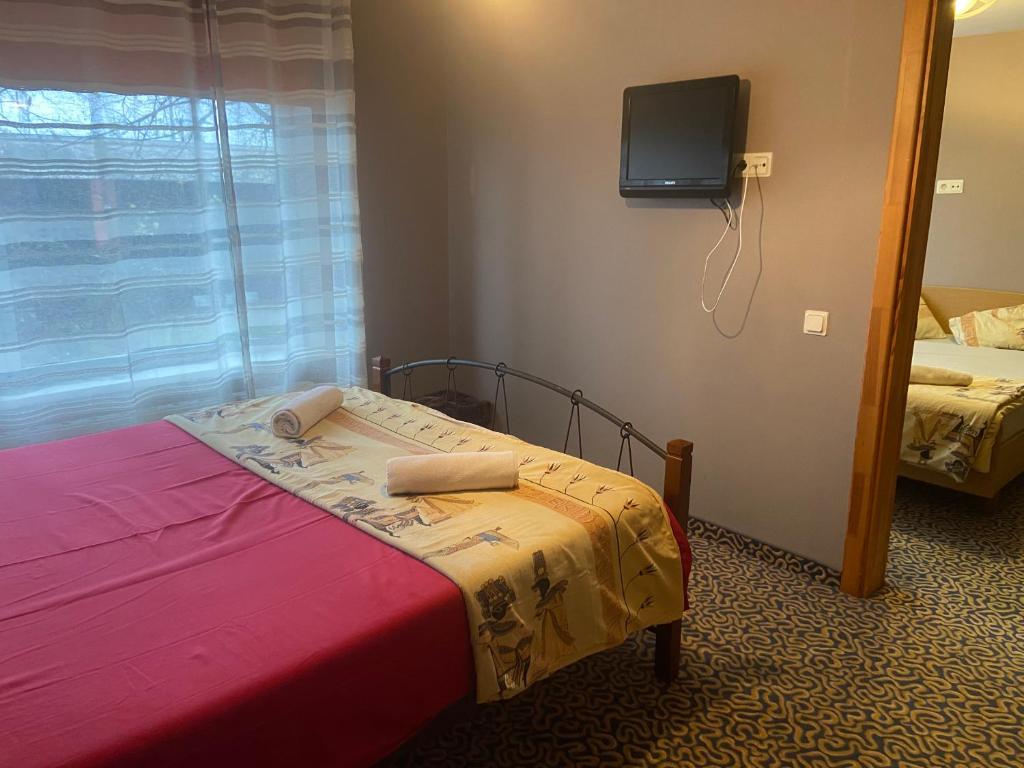 Кровать или кровати в номере Park Hotel Kekava