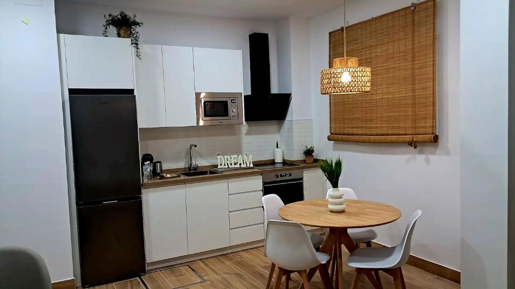 A cozinha ou cozinha compacta de Triana Tejares Apartment