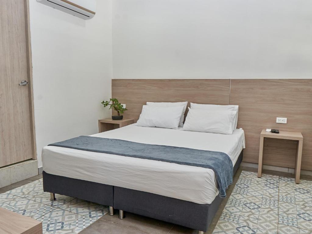 Postel nebo postele na pokoji v ubytování Stanza Hotel Medellin