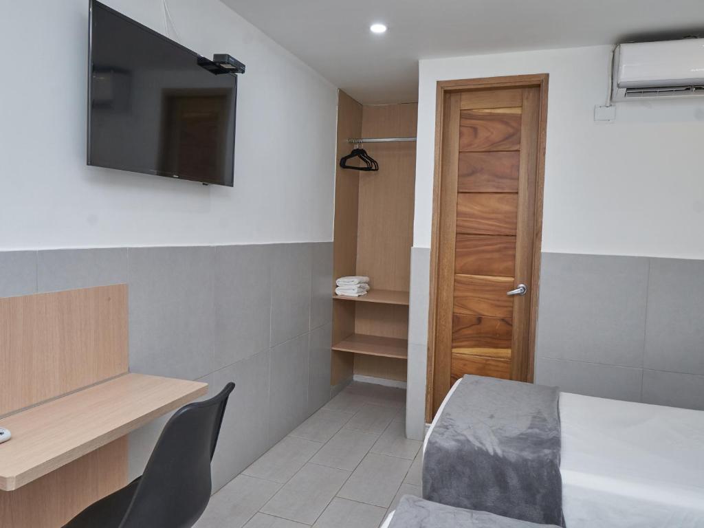 TV a/nebo společenská místnost v ubytování Stanza Hotel Medellin