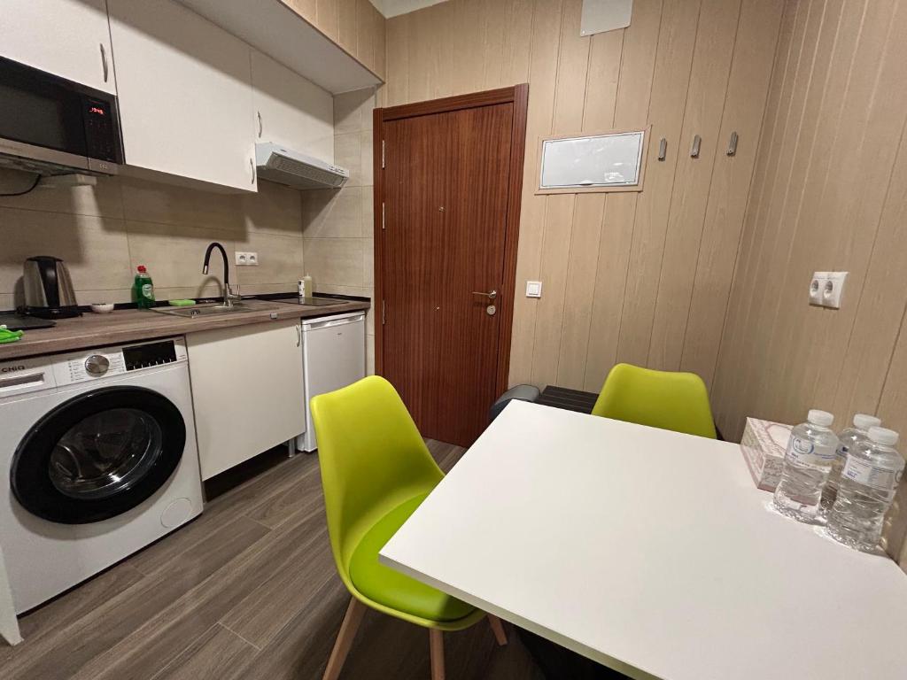 Kuchyň nebo kuchyňský kout v ubytování Alianza Suites