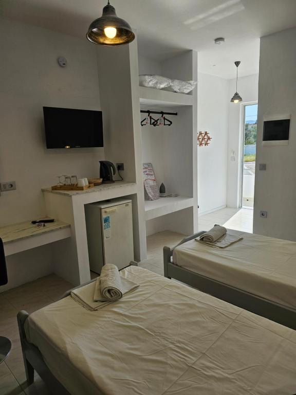 Postel nebo postele na pokoji v ubytování Lisabeth Apartments