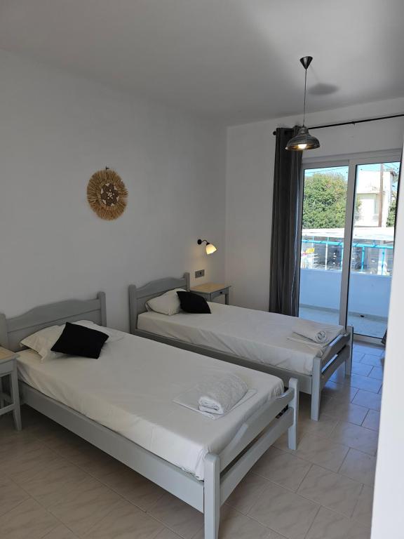 Postel nebo postele na pokoji v ubytování Lisabeth Apartments