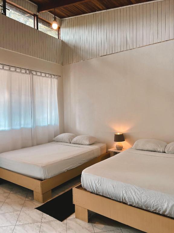 Postel nebo postele na pokoji v ubytování Hotel Exotic Lodge