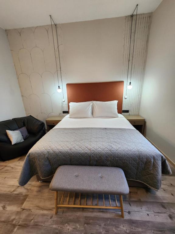 Postel nebo postele na pokoji v ubytování Hotel Amfiteatar