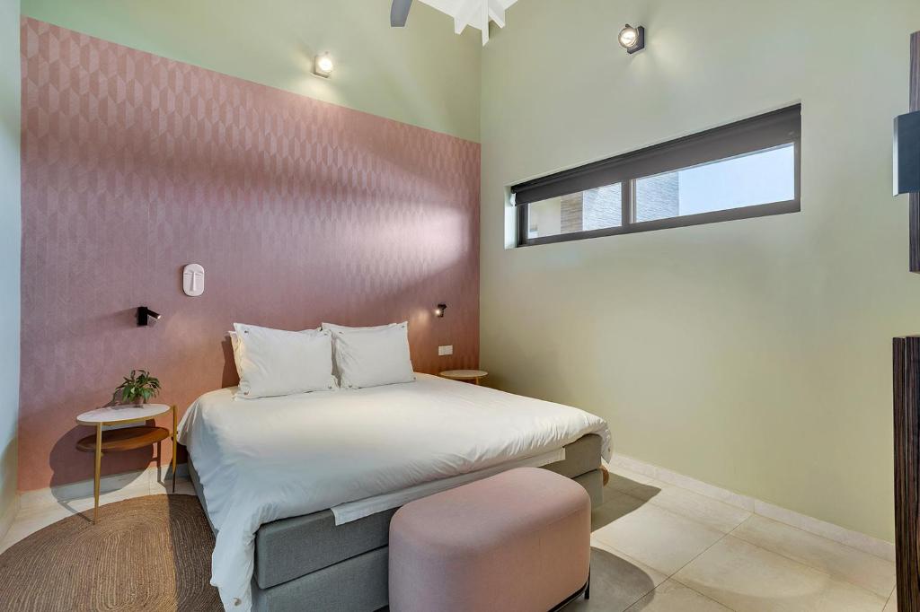 Postel nebo postele na pokoji v ubytování SENSES Boutique Hotel & Apartments