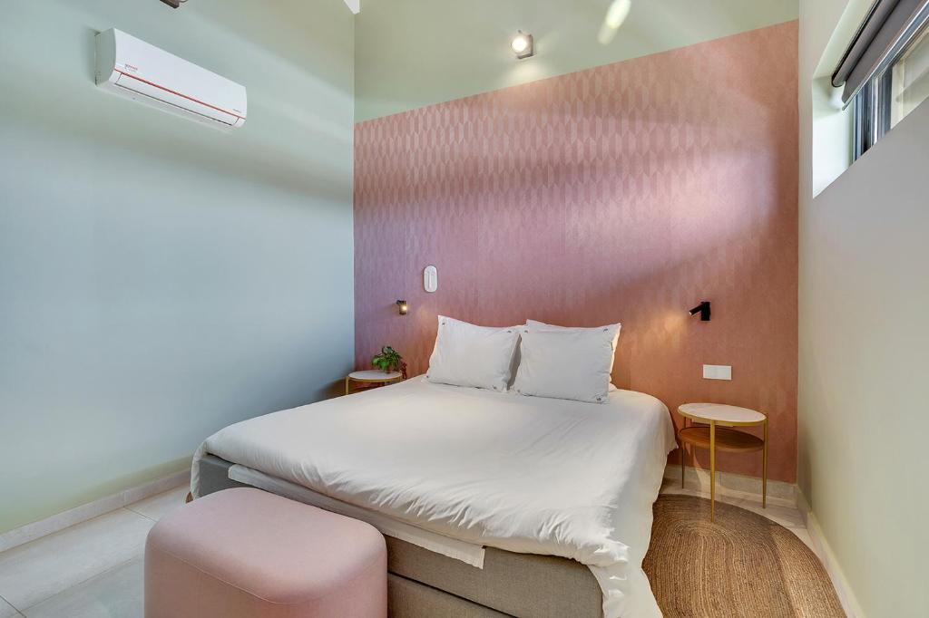 Postel nebo postele na pokoji v ubytování SENSES Boutique Hotel & Apartments