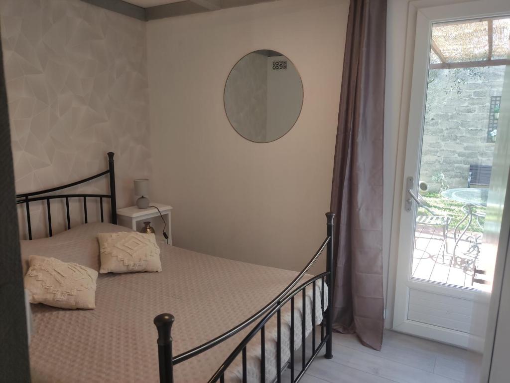 Postel nebo postele na pokoji v ubytování Maisonnette