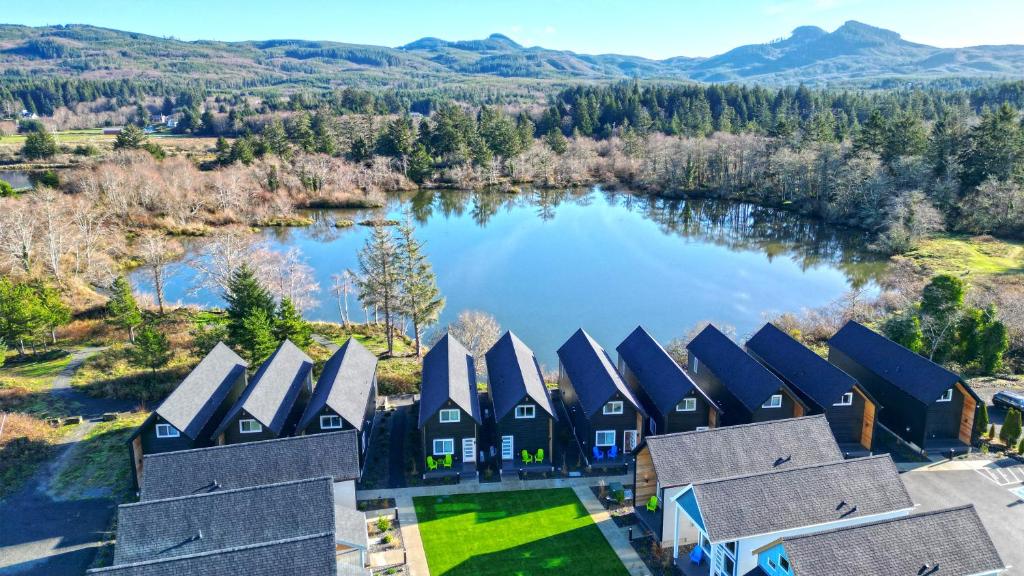 an aerial view of a house with a lake at The Commons - Urban Coastal Lodging in Seaside