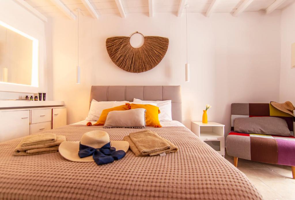 A bed or beds in a room at windmills suite by opus