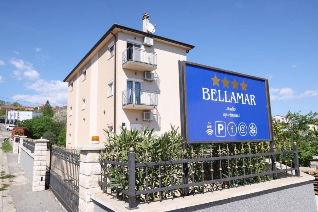 a sign in front of a building at Bellamar Apartments Kastav - Opatija in Kastav