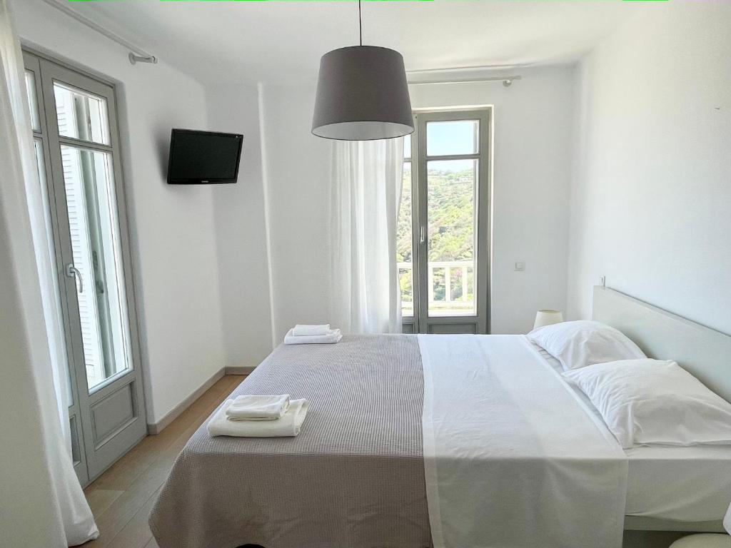 Postel nebo postele na pokoji v ubytování AEGEAN WINGS MAISONETTE