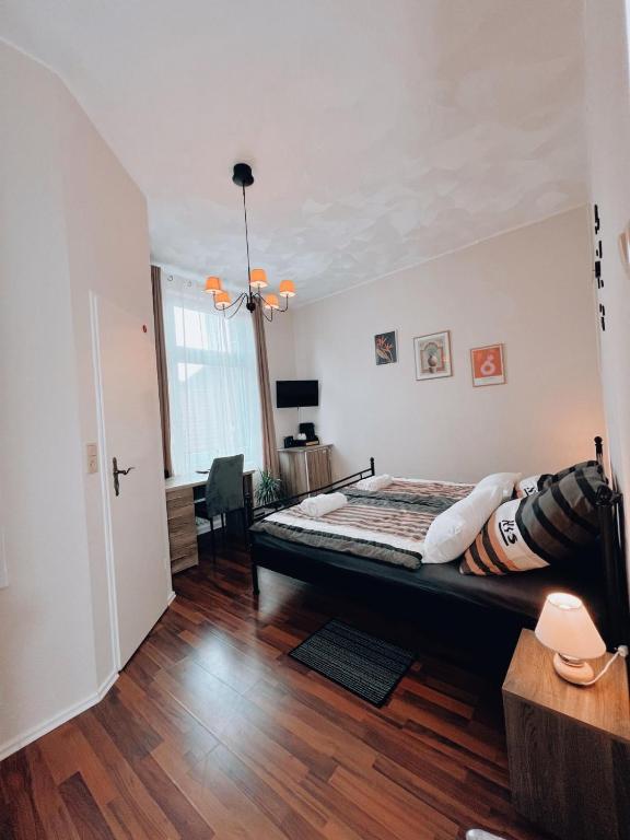 Postel nebo postele na pokoji v ubytování Dions Rooms