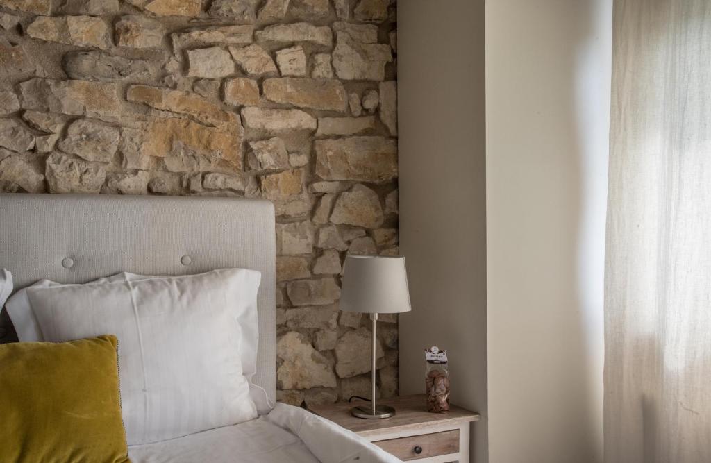 Postel nebo postele na pokoji v ubytování Le Paysan Horloger