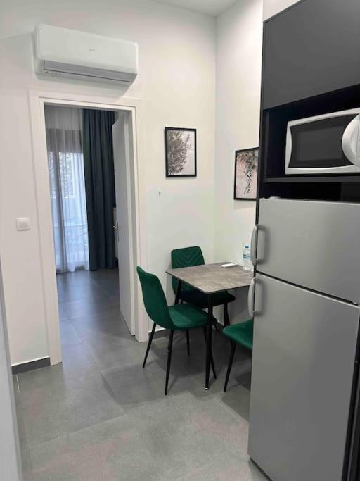 Kuchyň nebo kuchyňský kout v ubytování Cozy apartment in a new building apartment 5