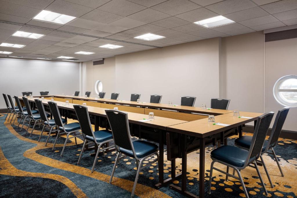 a large conference room with a long table and chairs at Courtyard Seattle Downtown / Pioneer Square in Seattle