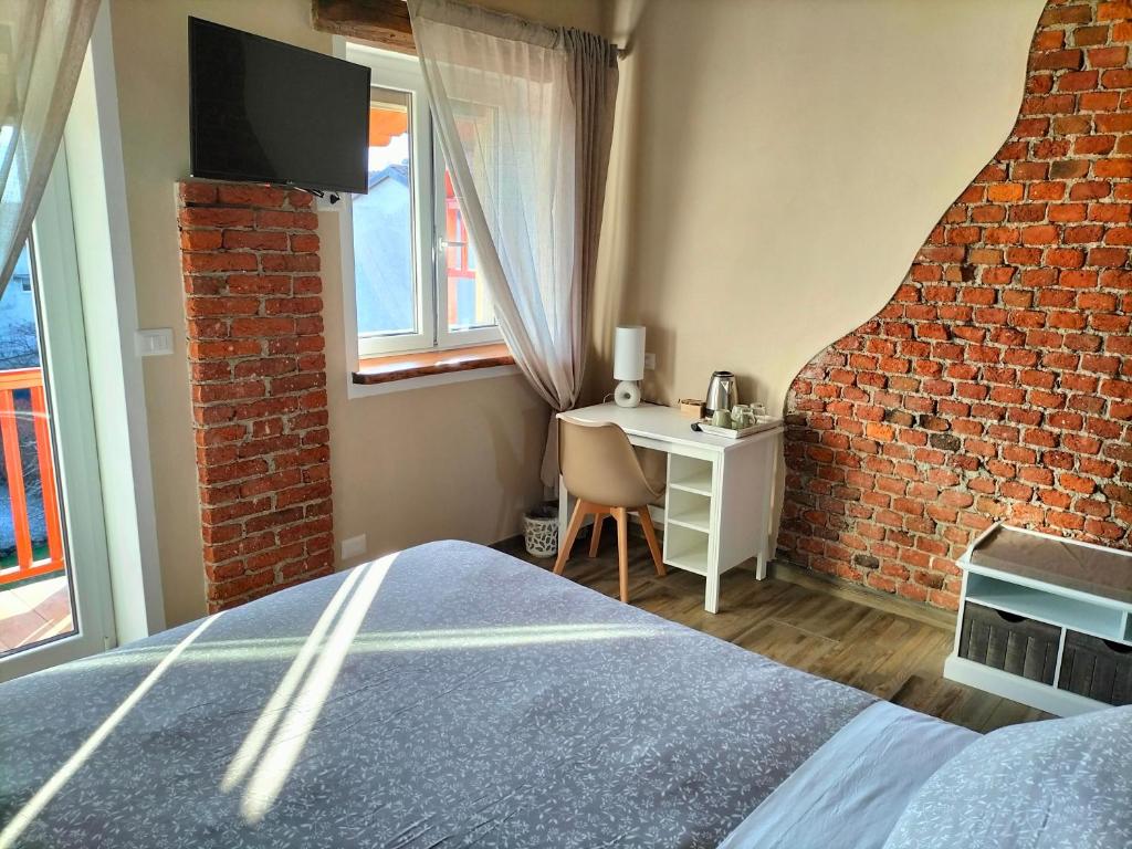 Postel nebo postele na pokoji v ubytování LOCANDA VECCHIO NOVECENTO