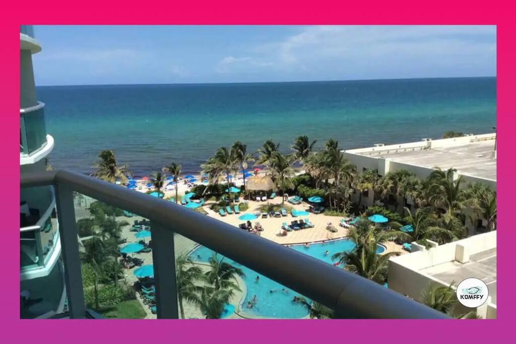 a view of the beach from the balcony of a resort at Komffy Home with King Bed & Ocean View at Tides in Hollywood