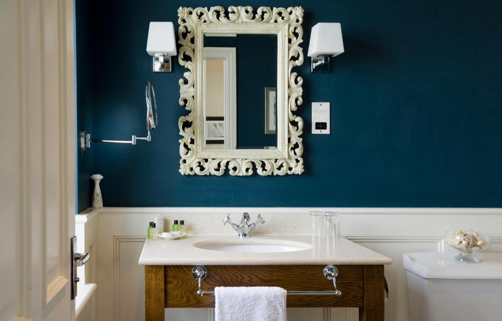 a bathroom with a sink and a mirror at The Marine in Whitstable