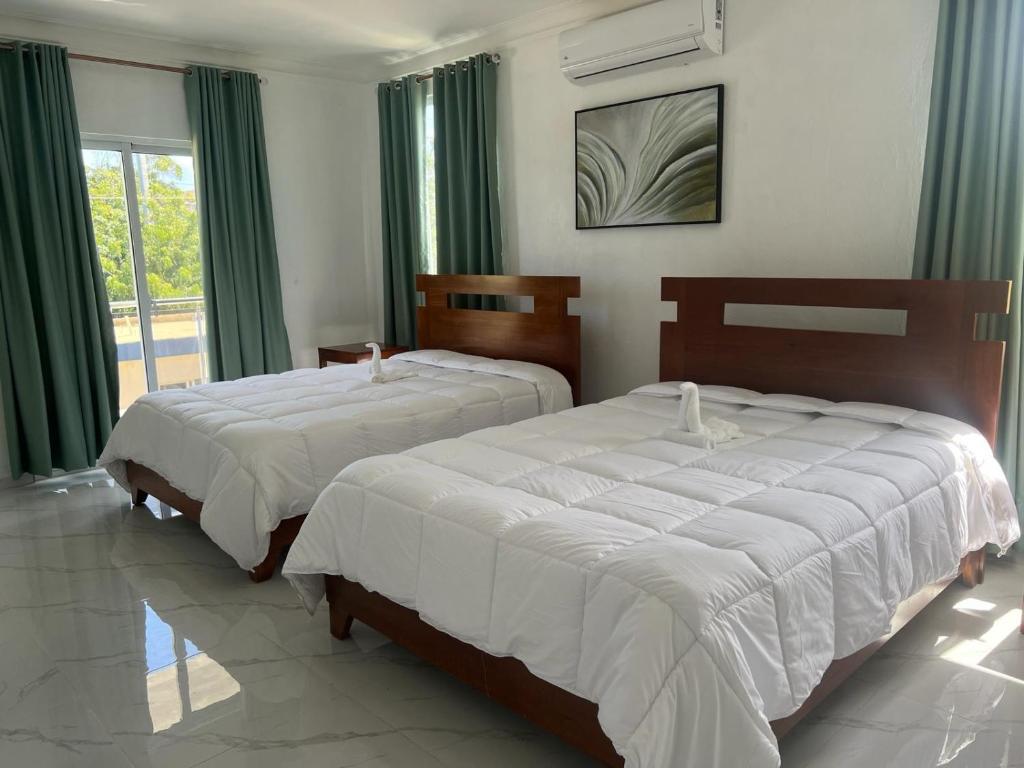 Postel nebo postele na pokoji v ubytování Luxury Beach Front Villa with Private pool and stunning Ocean View!