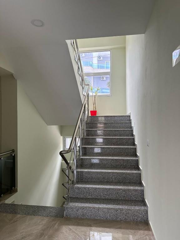 a staircase in a building with a stair case at Summer Gate Hotel in Ksamil