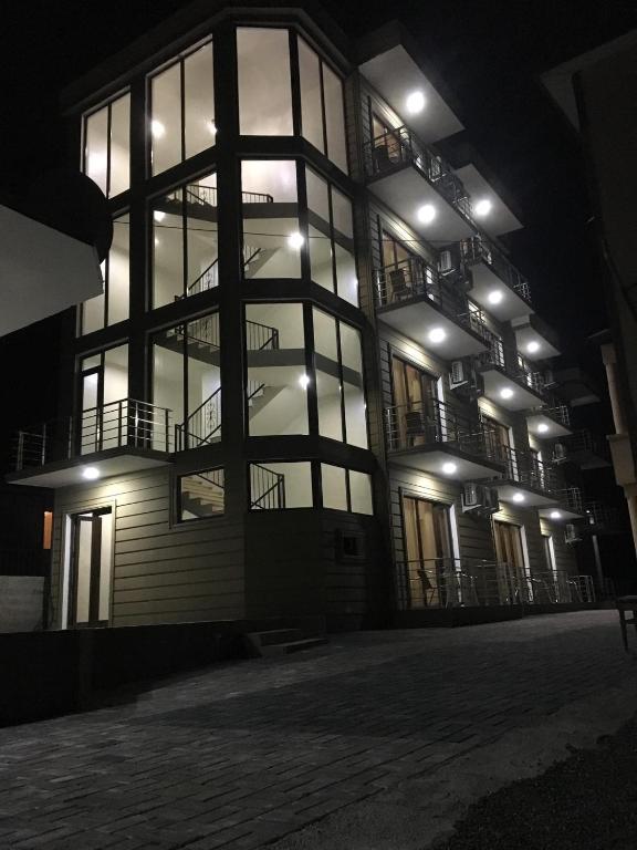 a building at night with lights on it at Guest House ILIA 345 in Kobuleti
