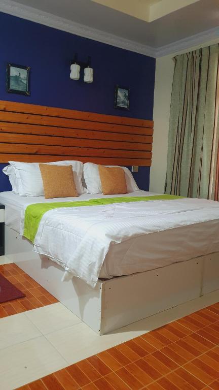 Postel nebo postele na pokoji v ubytování Finimas Residence