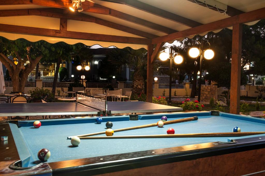 a pool table with cue balls on top of it at Kalamaki Beach Hotel, Zakynthos Island in Kalamaki