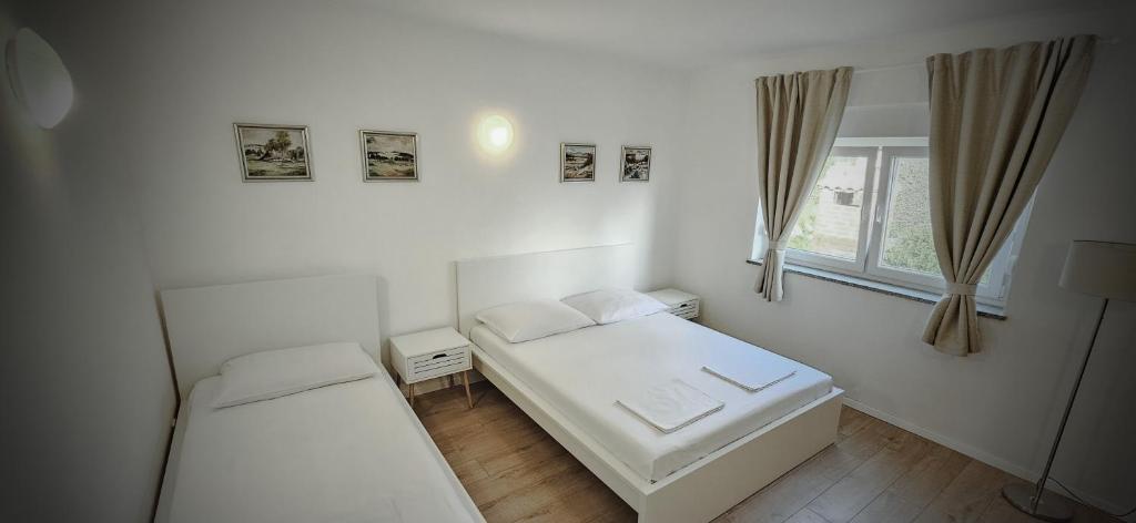 Łóżko lub łóżka w pokoju w obiekcie Apartment Buco