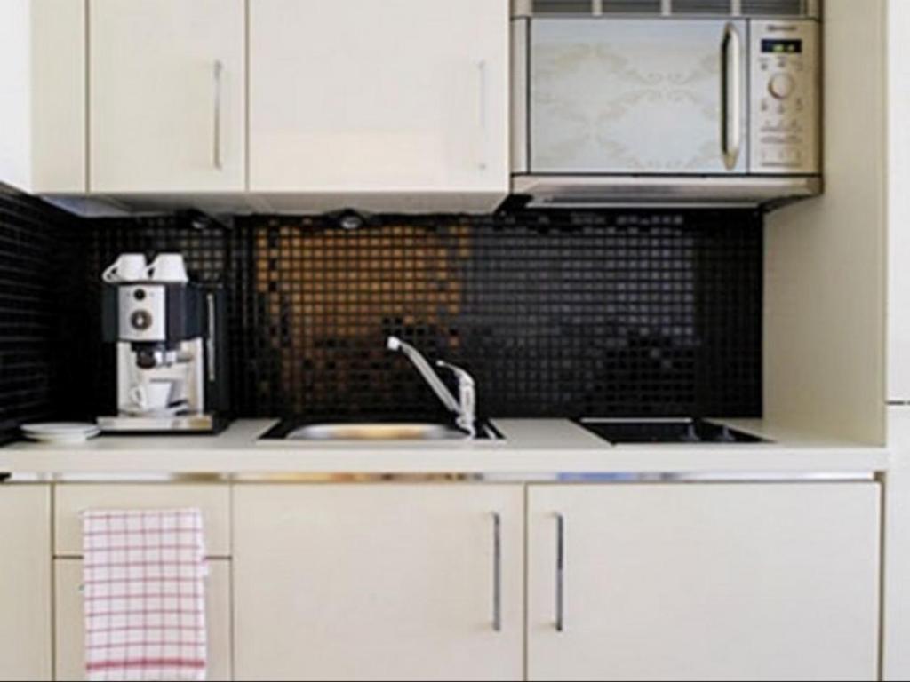 Kuchyň nebo kuchyňský kout v ubytování VISIONAPARTMENTS Rue Caroline - contactless check-in