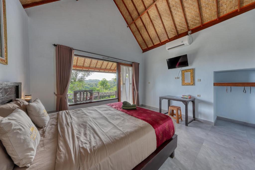 Postel nebo postele na pokoji v ubytování Ayu Hill Bungalows