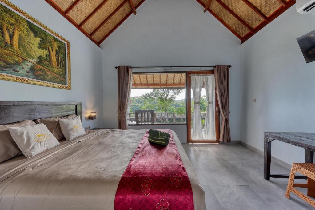 Postel nebo postele na pokoji v ubytování Ayu Hill Bungalows