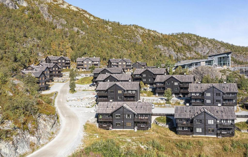 a group of houses on a hill with a road at Nice Apartment In Hemsedal With House A Mountain View in Hemsedal