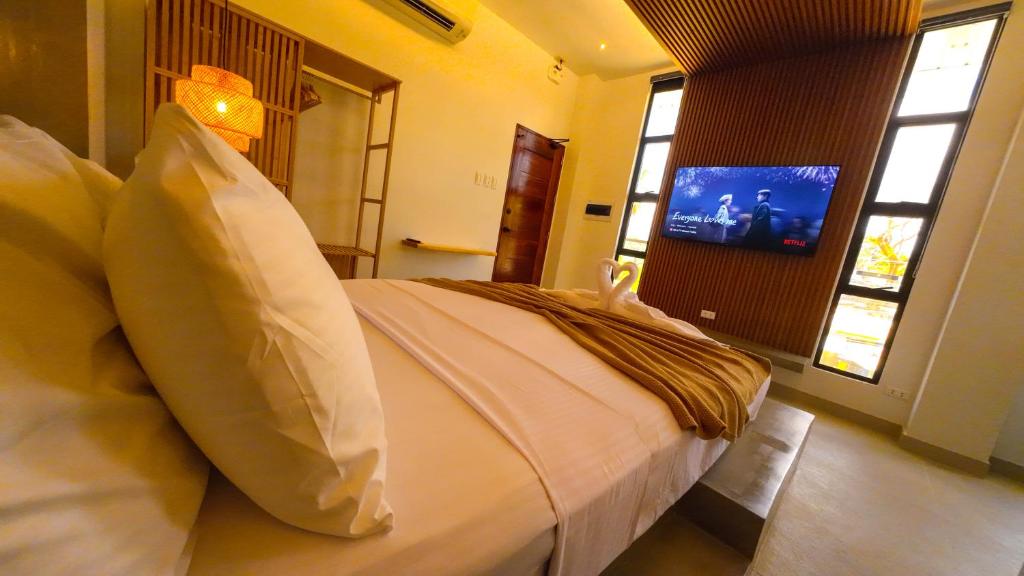 TV a/nebo společenská místnost v ubytování Go Boutique Inn