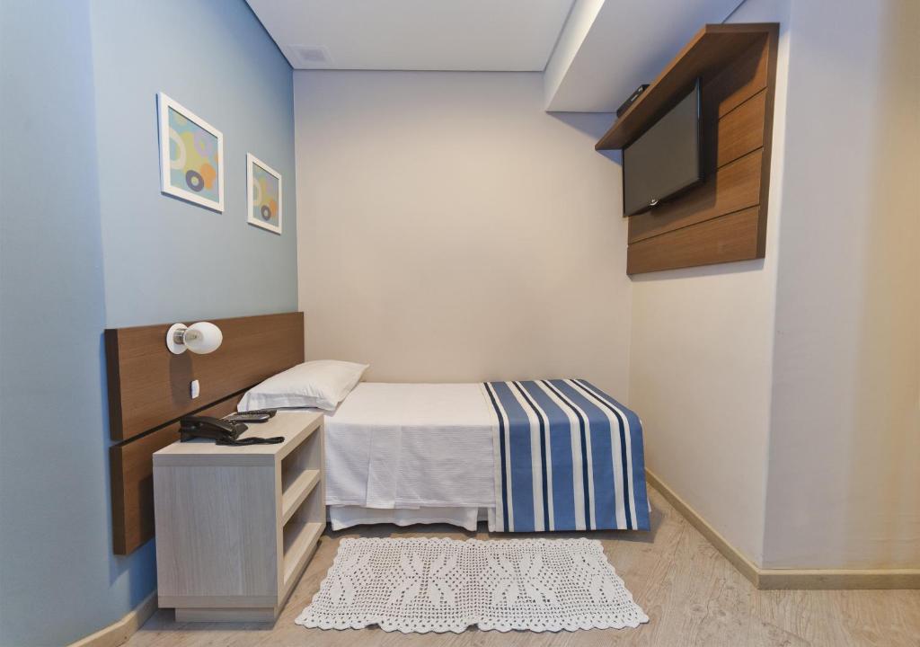 Postel nebo postele na pokoji v ubytování Hotel Sol By MRHotelaria