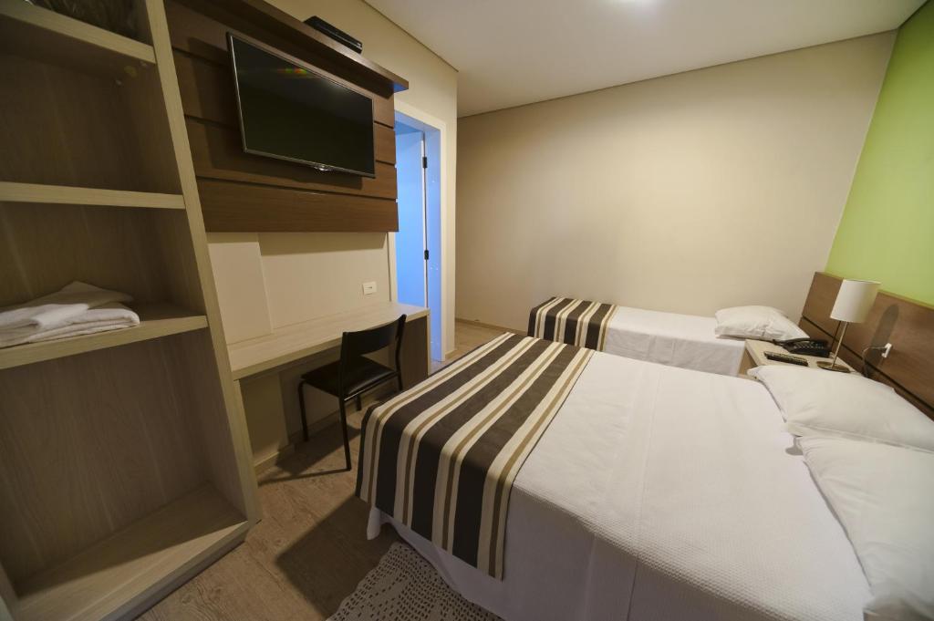 Postel nebo postele na pokoji v ubytování Hotel Sol By MRHotelaria