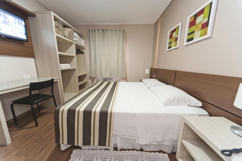 Postel nebo postele na pokoji v ubytování Hotel Sol By MRHotelaria