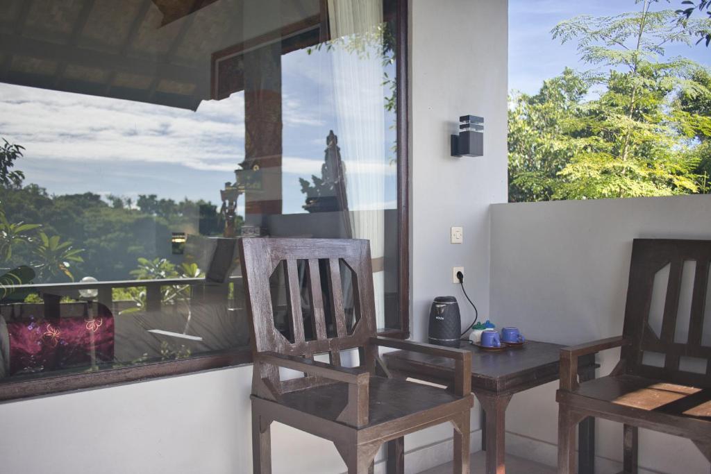 Balkón nebo terasa v ubytování Ayu Hill Bungalows