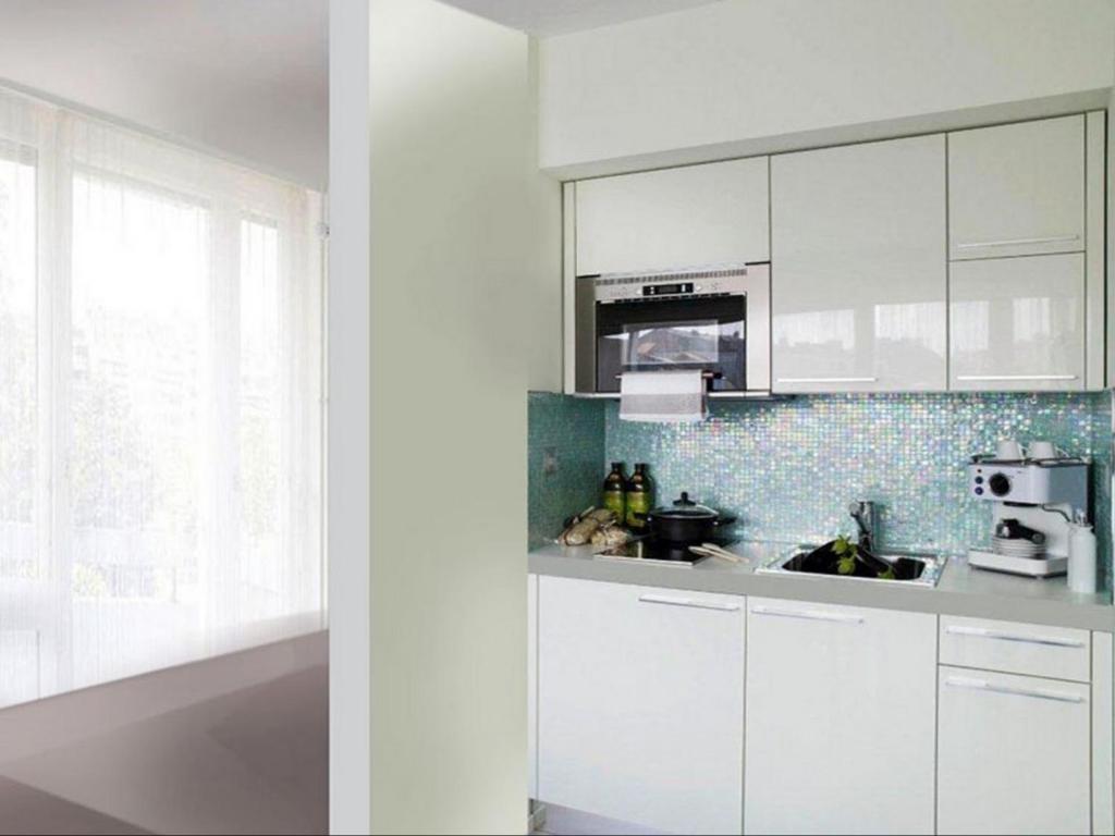 Kuchyň nebo kuchyňský kout v ubytování VISIONAPARTMENTS Rue Caroline - contactless check-in