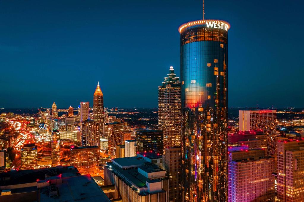 a view of a city skyline at night at The Westin Peachtree Plaza, Atlanta in Atlanta