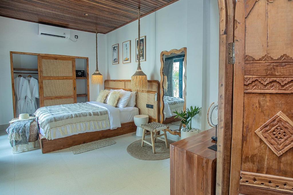 Ένα ή περισσότερα κρεβάτια σε δωμάτιο στο Good Day Villas Lembongan