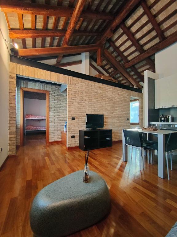 a living room with a table and a couch at Urban 34 - station & centre in Treviso